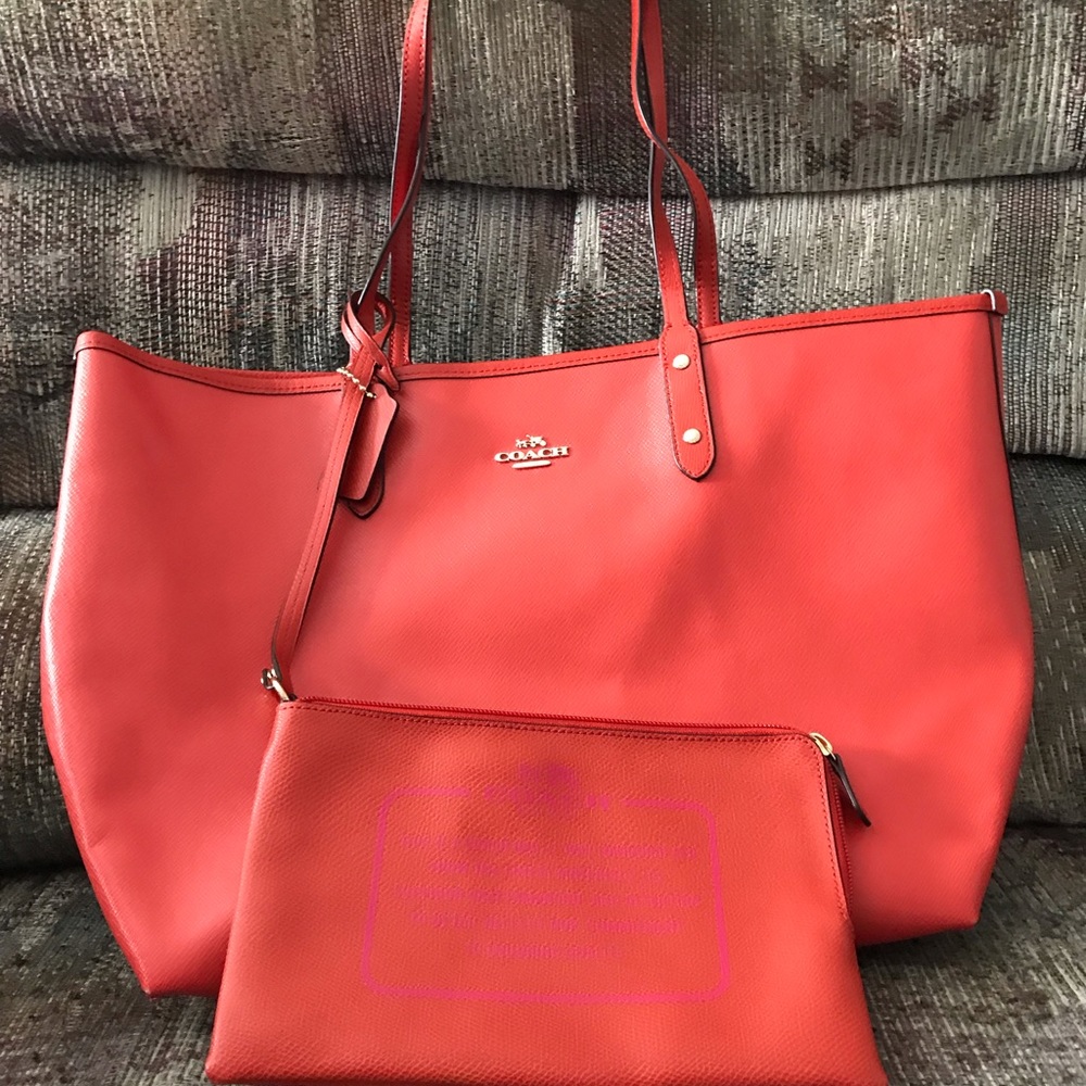 Coach Salmon and fuchsia reversible tote.